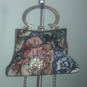 Floral embroidered purse with metal handle